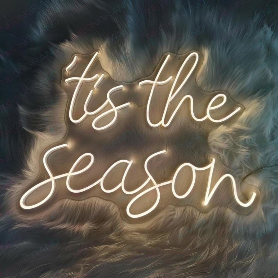 Tis The Season Merry Christmas Neon Sign by Neon.Shop glowing in LED light with festive lettering design.