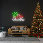 Truck Merry Christmas LED neon sign glowing in festive colors by Neon.Shop.