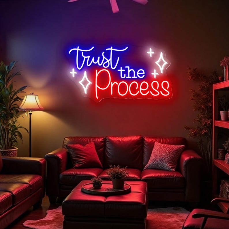 Trust The Process” neon sign illuminating a workspace, encouraging focus and perseverance by Neon.Shop.