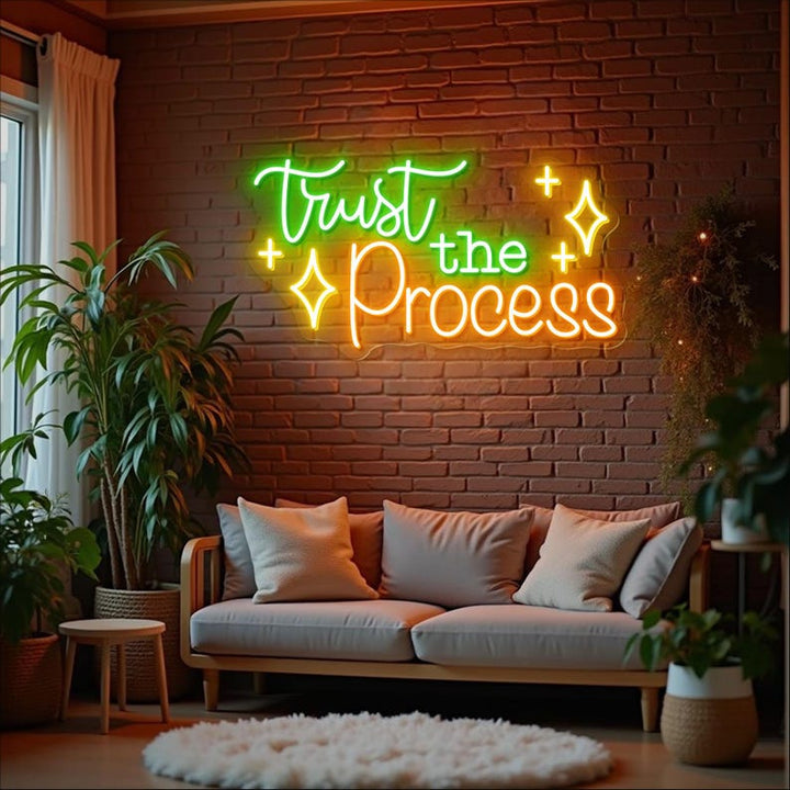 Trust The Process” neon sign illuminating a workspace, encouraging focus and perseverance by Neon.Shop.