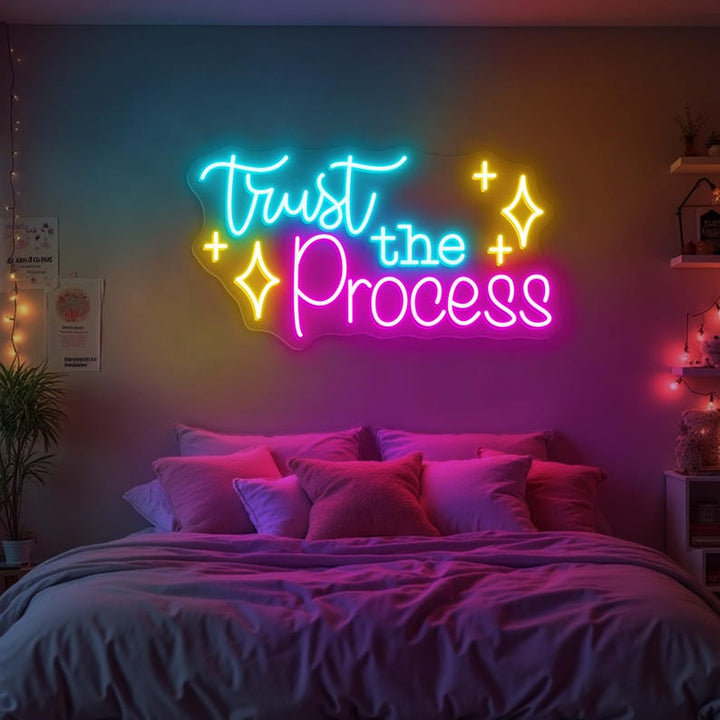 Trust The Process” neon sign illuminating a workspace, encouraging focus and perseverance by Neon.Shop.