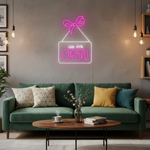 We Are Open Business Neon Sign by Neon.Shop glowing in a shop window