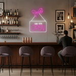 We Are Open Business Neon Sign by Neon.Shop glowing in a shop window