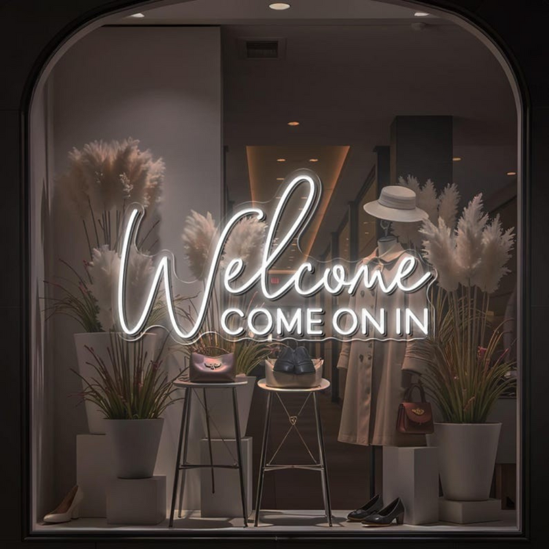 Welcome Come On In Business Neon Sign by Neon.Shop glowing in a shop window