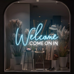 Welcome Come On In Business Neon Sign by Neon.Shop glowing in a shop window