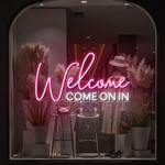 Welcome Come On In Business Neon Sign by Neon.Shop glowing in a shop window