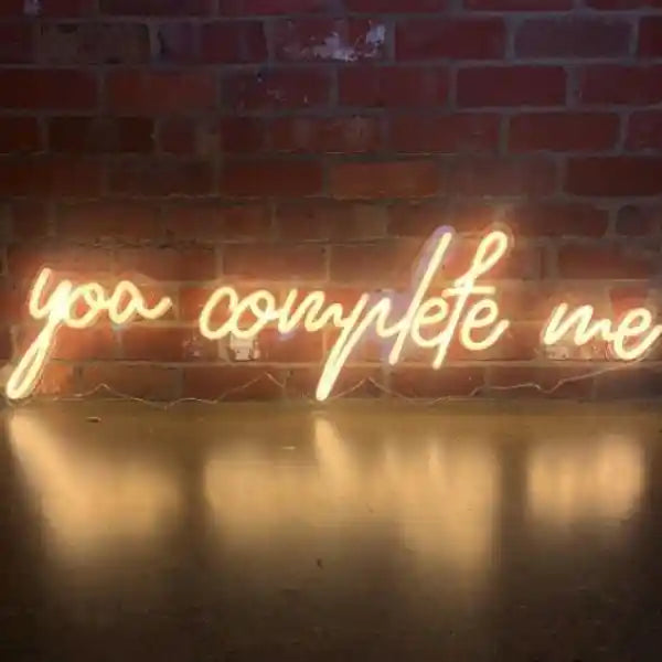 You Complete Me Wedding LED Neon Sign glowing at reception by Neon.Shop  - Warm White 
