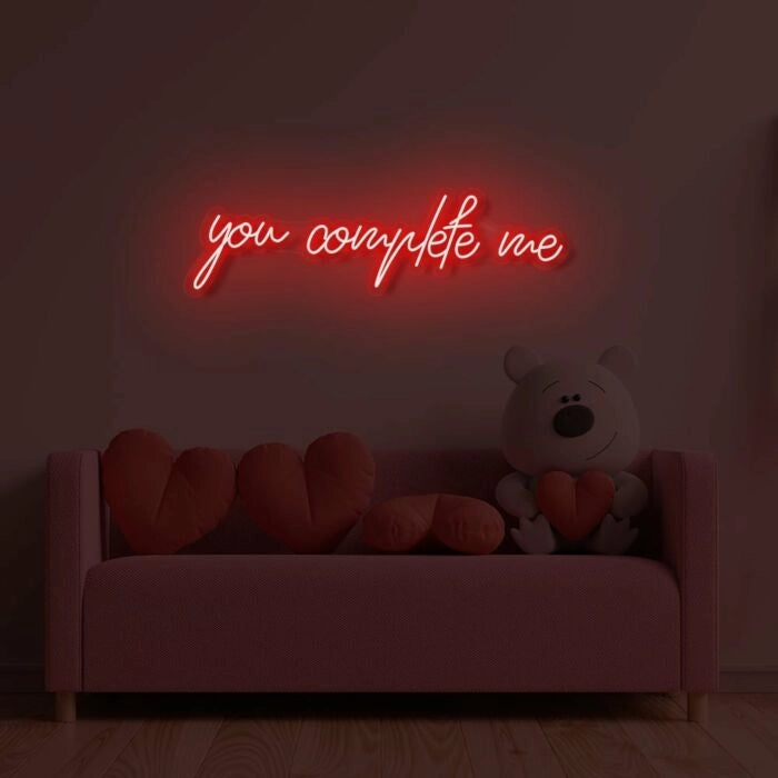 You Complete Me Wedding LED Neon Sign glowing at reception by Neon.Shop - Red 