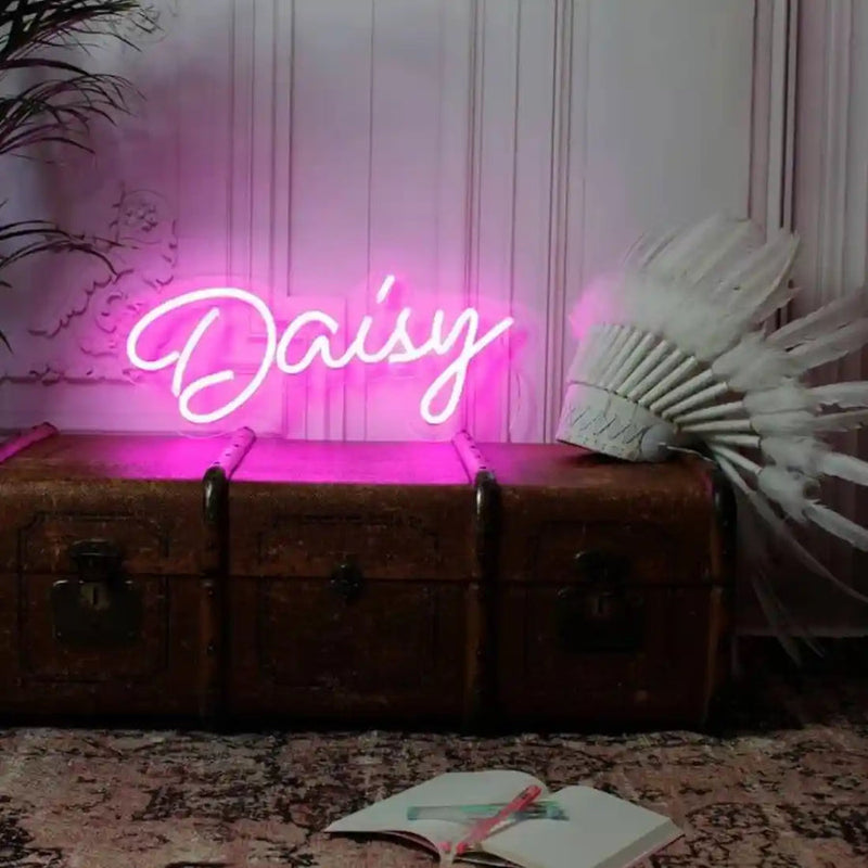 DAISY Name LED Neon Sign by Neon.Shop glowing brightly, custom LED name light for bedroom décor, nurseries, salons, parties, and personalized home styling.