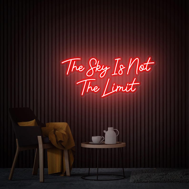 The Sky Is Not The Limit” inspirational LED neon wall light, perfect for creative spaces, gyms, and home workspaces by Neon.Shop.