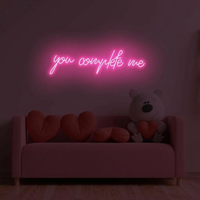 You Complete Me Wedding LED Neon Sign glowing at reception by Neon.Shop  - Pink 