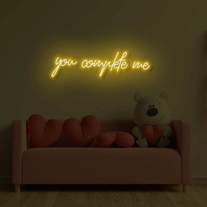 You Complete Me Wedding LED Neon Sign glowing at reception by Neon.Shop - Yellow 
